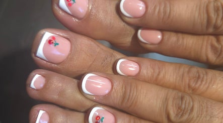 Elegant French pedicure with floral nail art at Nails by Monika in Torremolinos, Malaga, ES.