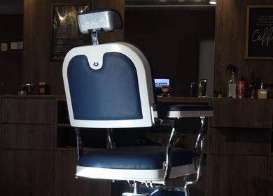 Premium barber chair at Frank Barber Shop, Panamá, Provincia De Panamá, PA, ready for precision grooming.