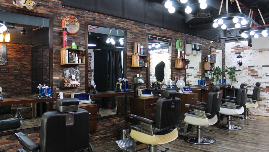 Interior of Tornado Gents Salon - JLT, Dubai, Dubai, AE showcasing vintage barber chairs and rustic décor.