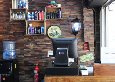 Reception at Tornado Gents Salon - JLT, Dubai, Dubai, AE, featuring wooden decor and haircare products.
