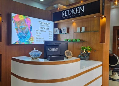 Reception at Tornado Gents Salon - Marina in Dubai, Dubai, AE featuring modern decor and service list.