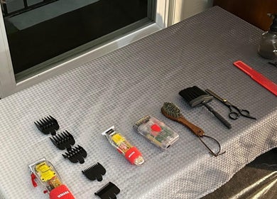 Professional hairdressing tools on display at FT Cuts, Sylvania, Ohio, US, including combs and clippers.