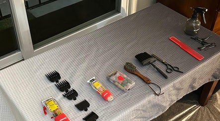 Professional hairdressing tools on display at FT Cuts, Sylvania, Ohio, US, including combs and clippers.