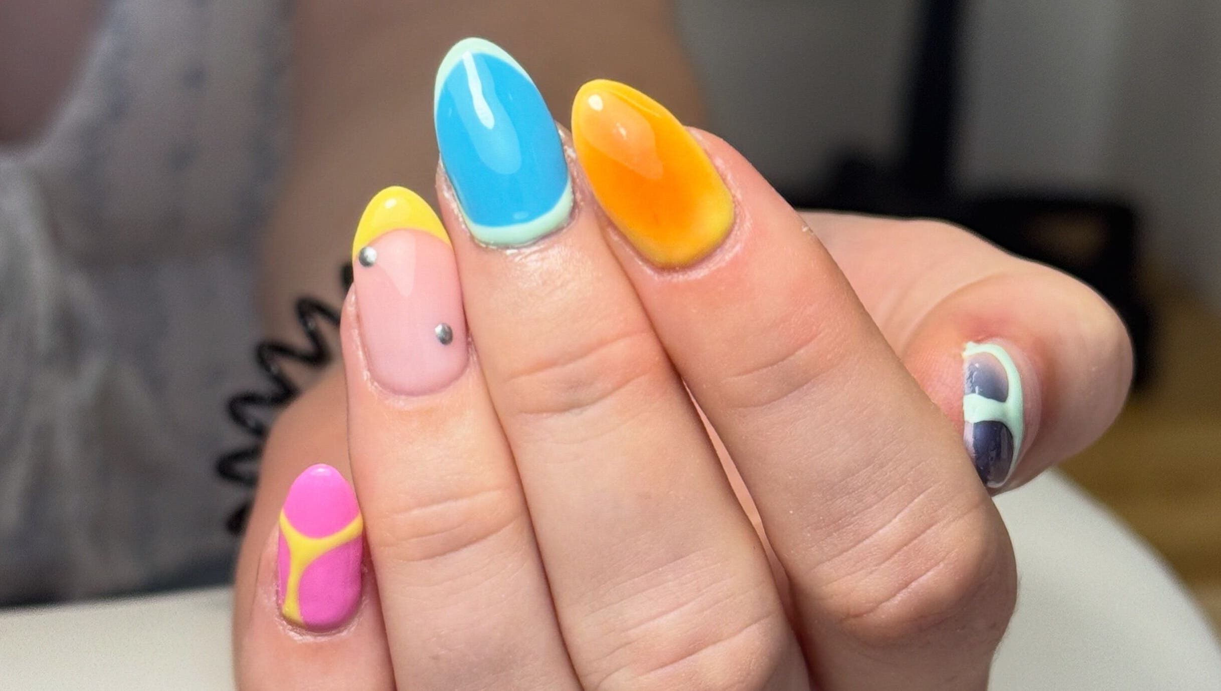 Colorful nail art at Beauty by Taylor, Halfway, England, GB. Vibrant design with bright shades.