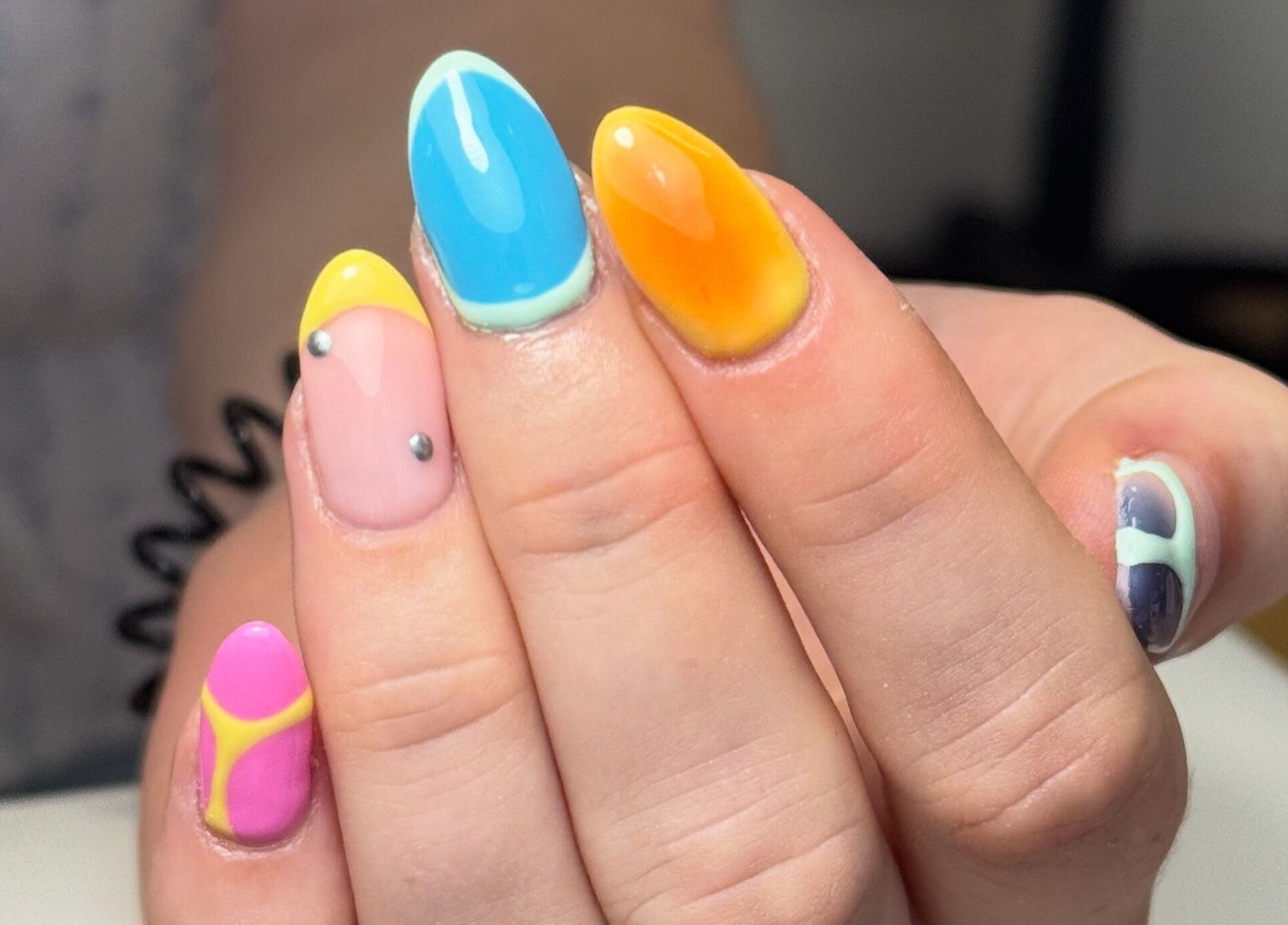 Colorful nail art at Beauty by Taylor, Halfway, England, GB. Vibrant design with bright shades.