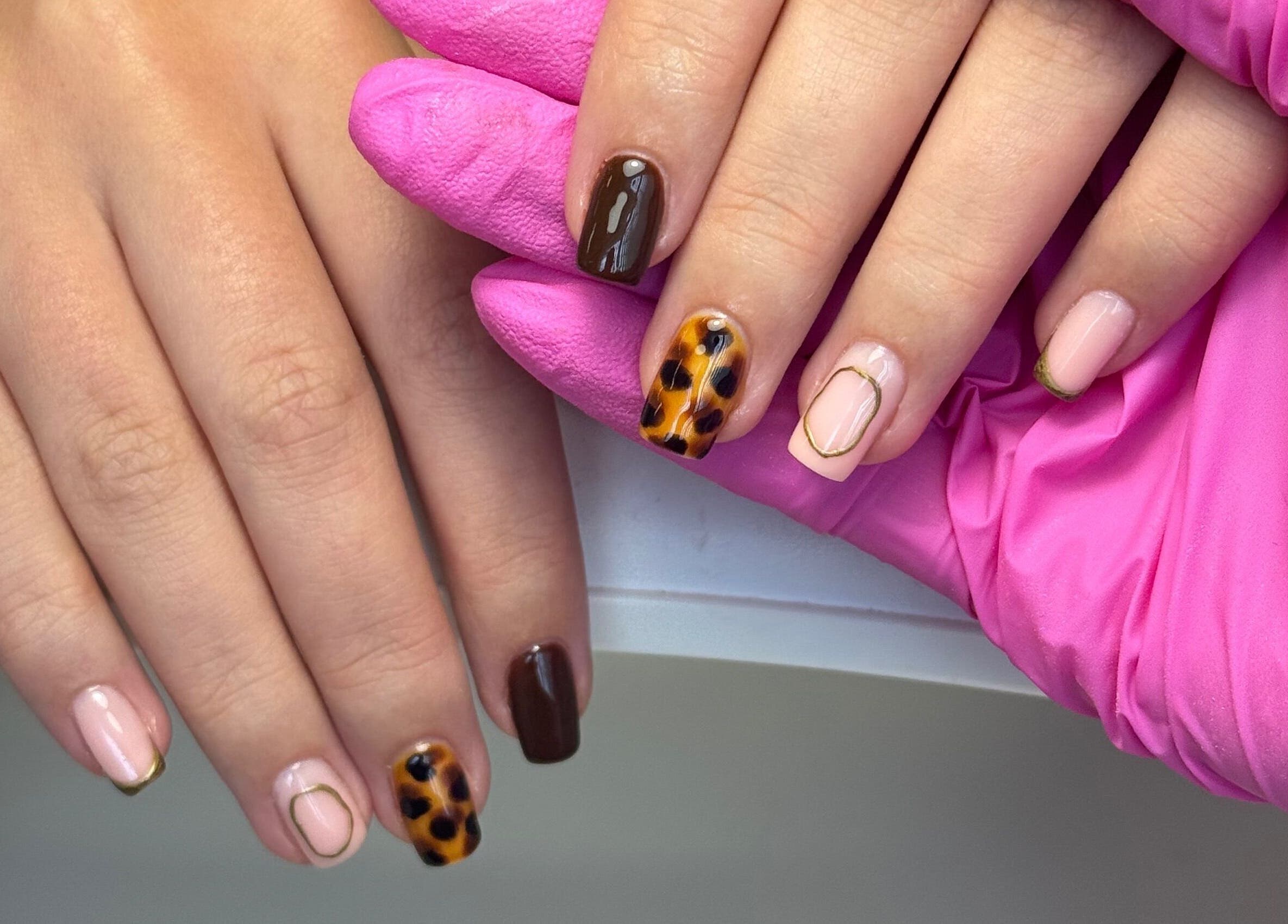 Elegant nail art at Beauty by Taylor, Halfway, England, GB, showcasing unique design on manicured hands.