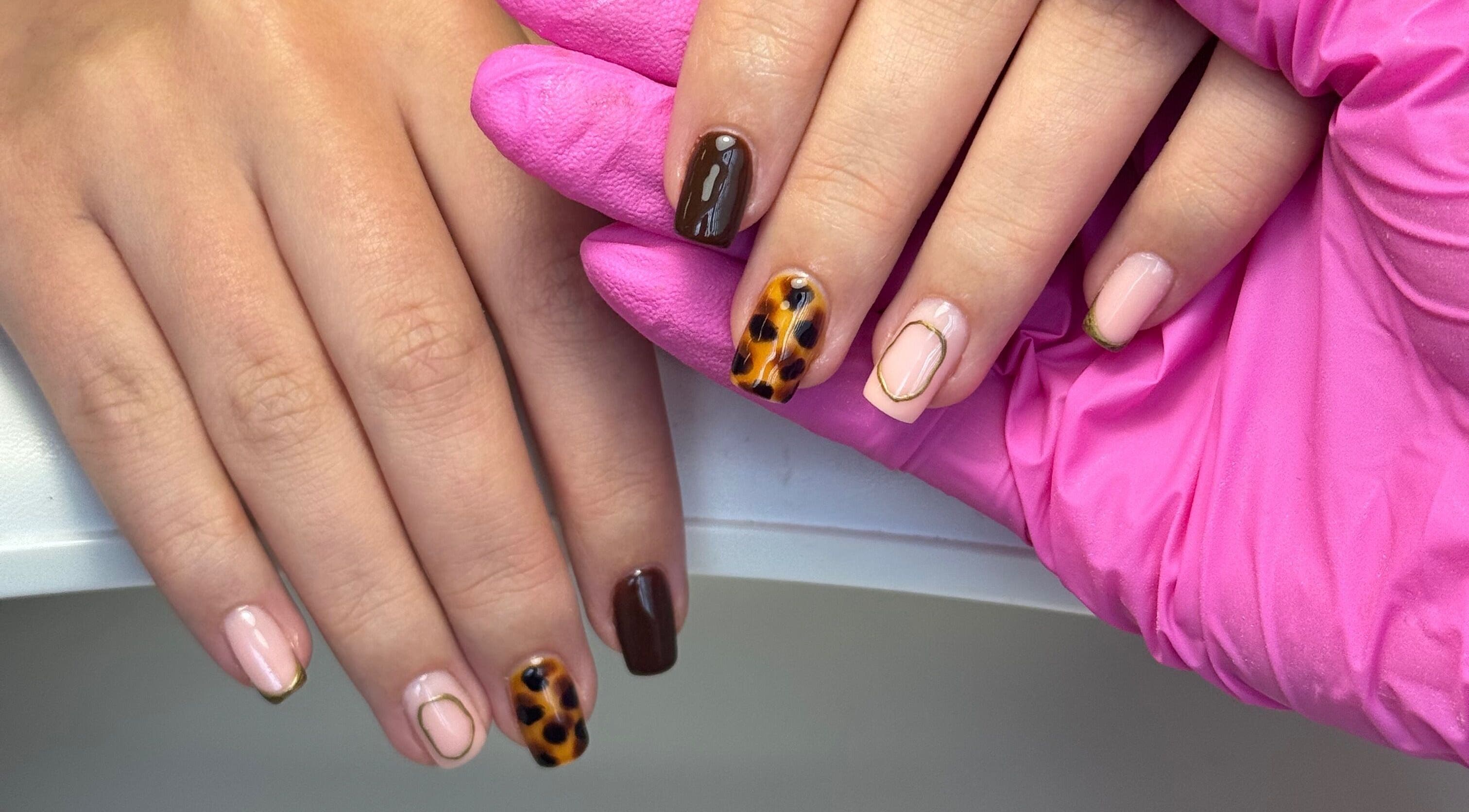 Elegant nail art at Beauty by Taylor, Halfway, England, GB, showcasing unique design on manicured hands.