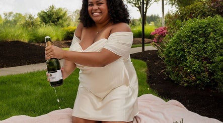 Woman in white dress enjoys a celebratory moment at Jb_beautyhub_ garden, Lagos, Lagos, NG.