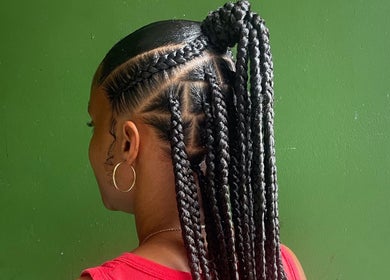Intricate braids styled at Mimi’s Touch in St. Joseph, Saint Joseph Parish, DM. Perfect example of local artistry.