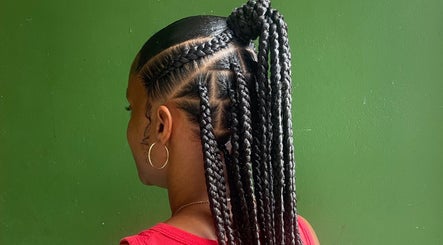 Intricate braids styled at Mimi’s Touch in St. Joseph, Saint Joseph Parish, DM. Perfect example of local artistry.