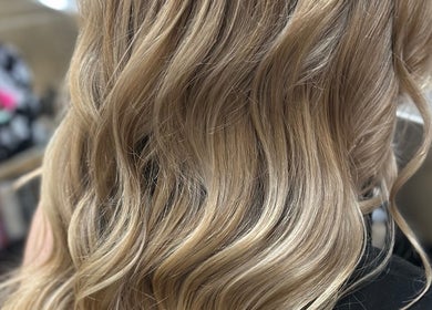 Blonde wavy hairstyle at Hair By Em in Choudrant, Louisiana, US.
