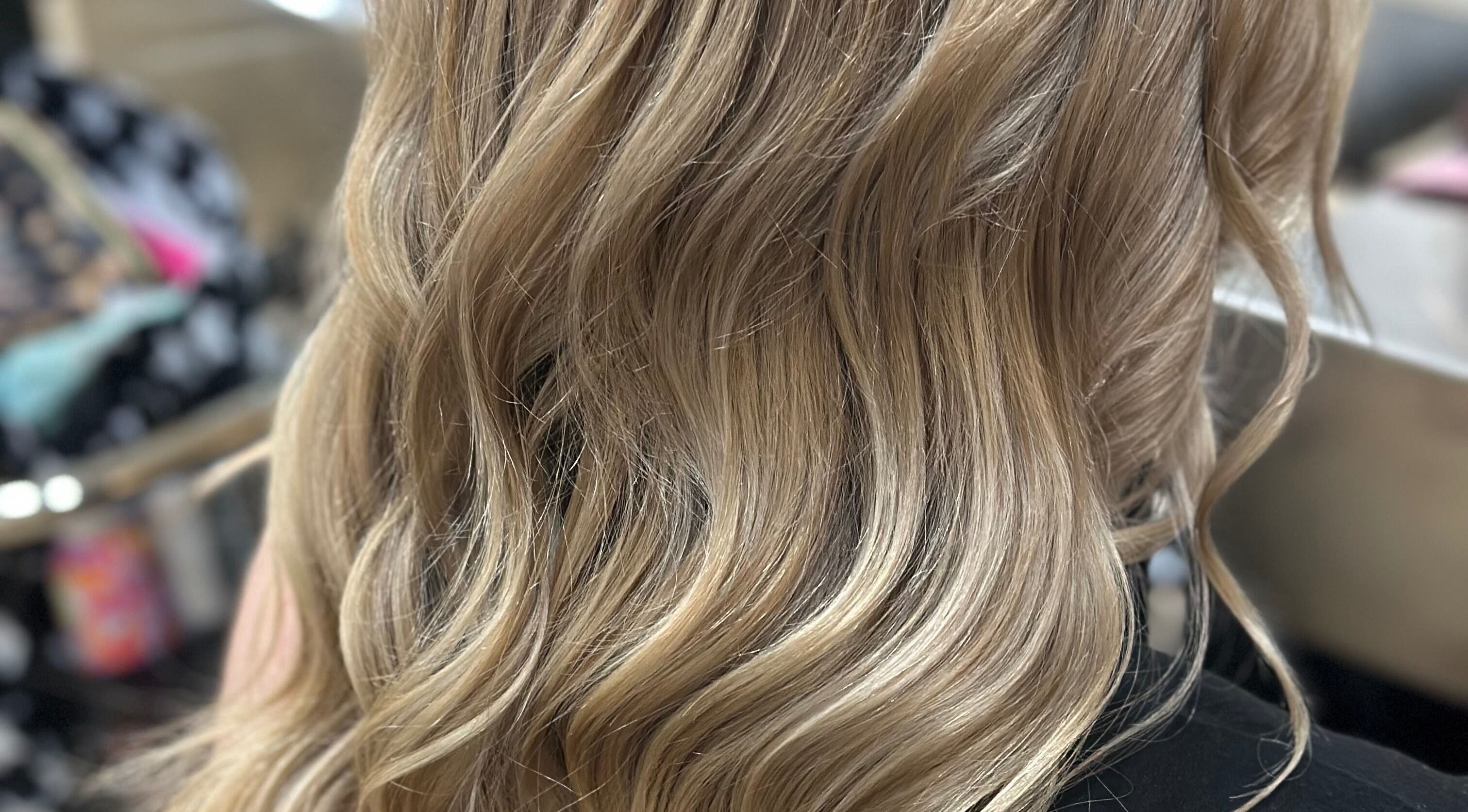 Blonde wavy hairstyle at Hair By Em in Choudrant, Louisiana, US.