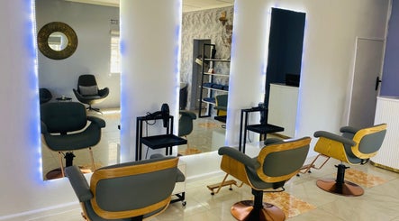 Modern salon interior at Beauty By Moi, Lusaka, Lusaka Province, ZM with stylish chairs and mirrors.