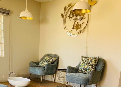 Elegant seating at Beauty By Moi, Lusaka, Lusaka Province, ZM featuring plush chairs and stylish decor.
