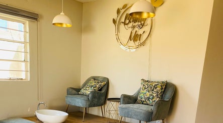 Elegant seating at Beauty By Moi, Lusaka, Lusaka Province, ZM featuring plush chairs and stylish decor.