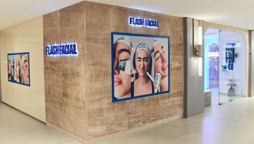 Flash Facial Ladies Salon entrance in Dubai, AE, showcasing stylish wall art and bright interiors.