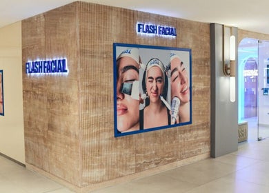 Flash Facial Ladies Salon entrance in Dubai, AE, showcasing stylish wall art and bright interiors.