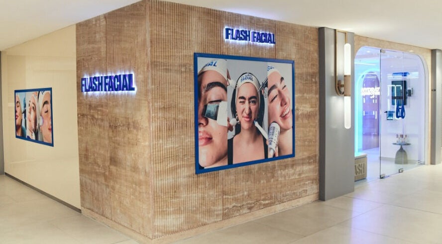Flash Facial Ladies Salon entrance in Dubai, AE, showcasing stylish wall art and bright interiors.
