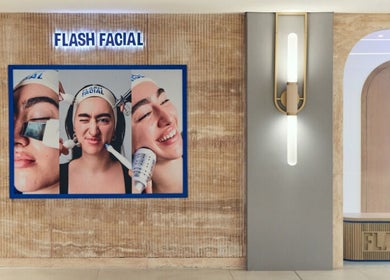 Entrance of Flash Facial Ladies Salon in Dubai, AE with a stylish display featuring skincare treatments.