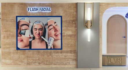 Entrance of Flash Facial Ladies Salon in Dubai, AE with a stylish display featuring skincare treatments.