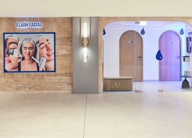Entrance of Flash Facial Ladies Salon in Dubai, AE, showcasing modern decor and a welcoming ambiance.