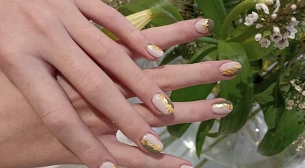 Elegant nail art with gold accents at Glam Guru, Sandton, Gauteng, ZA. Perfect for beauty enthusiasts.