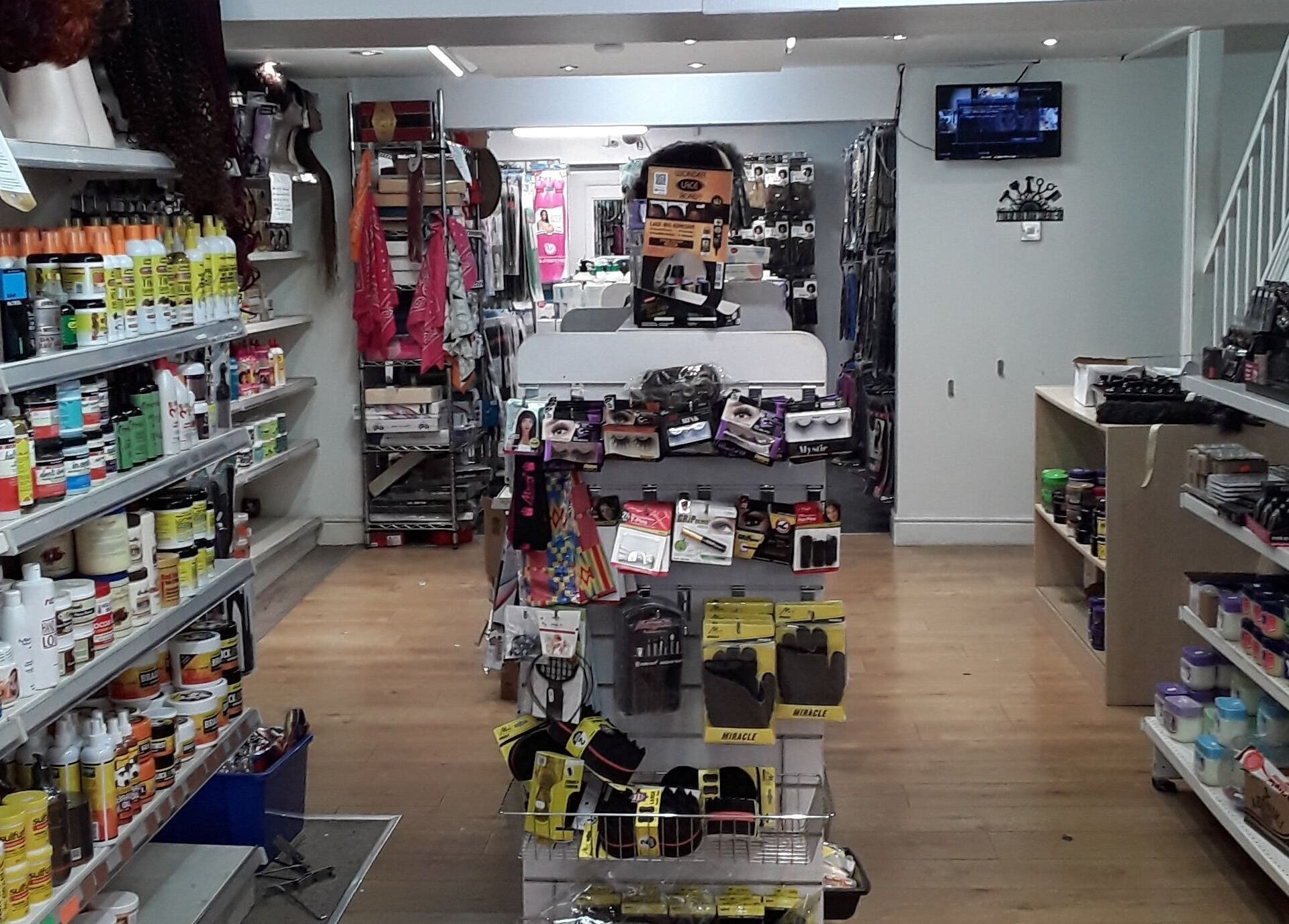 Product shelves at Nu-trendz Hair and Beauty Ltd, Colchester, England filled with hair and beauty supplies.