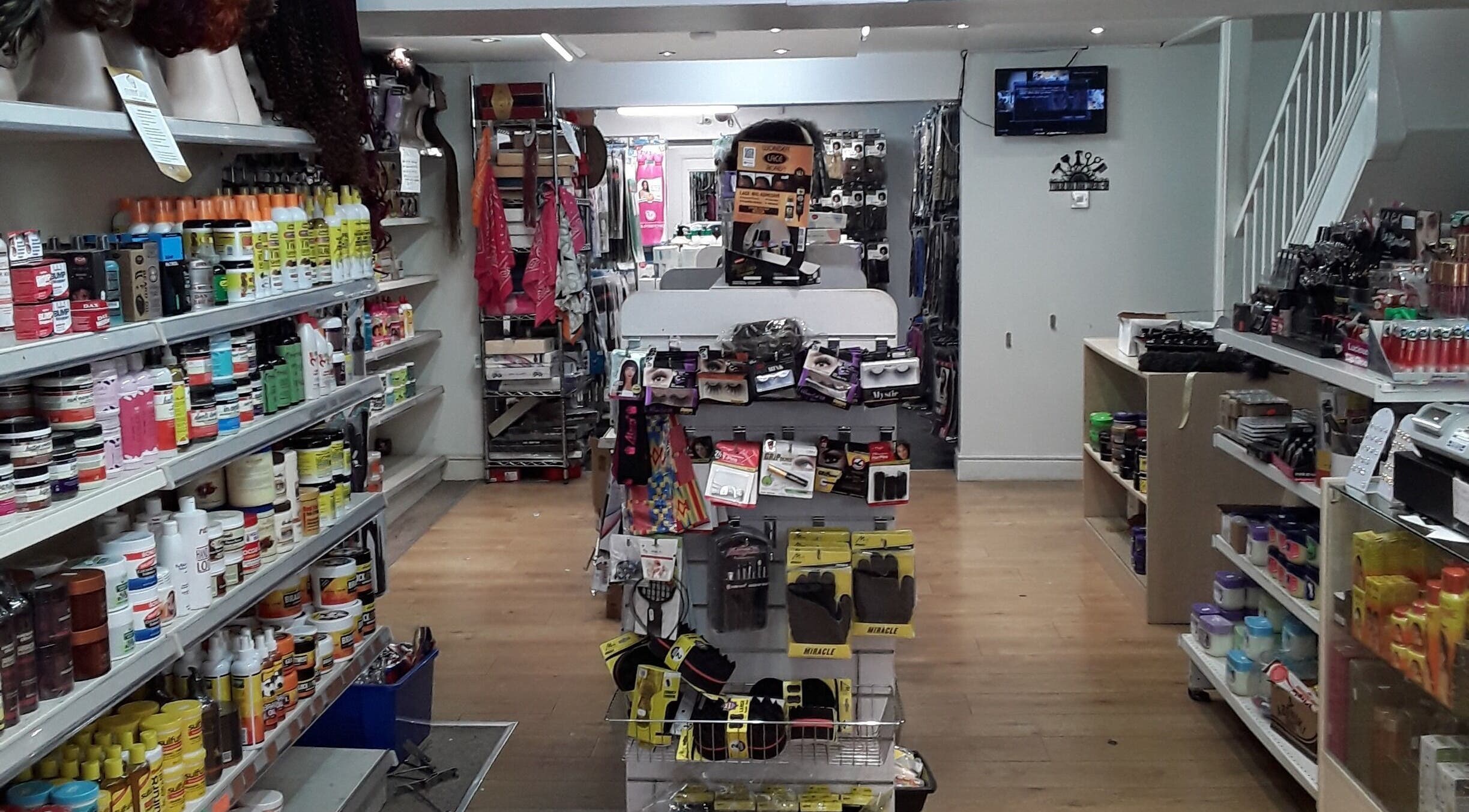 Product shelves at Nu-trendz Hair and Beauty Ltd, Colchester, England filled with hair and beauty supplies.