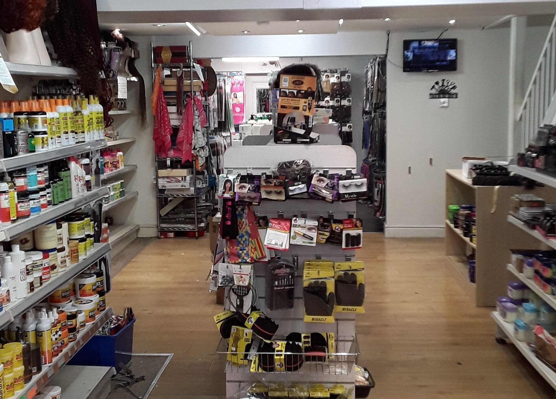 Interior of Nu-trendz hair and beauty ltd in Colchester, England, GB showcasing beauty products neatly arranged on shelves.