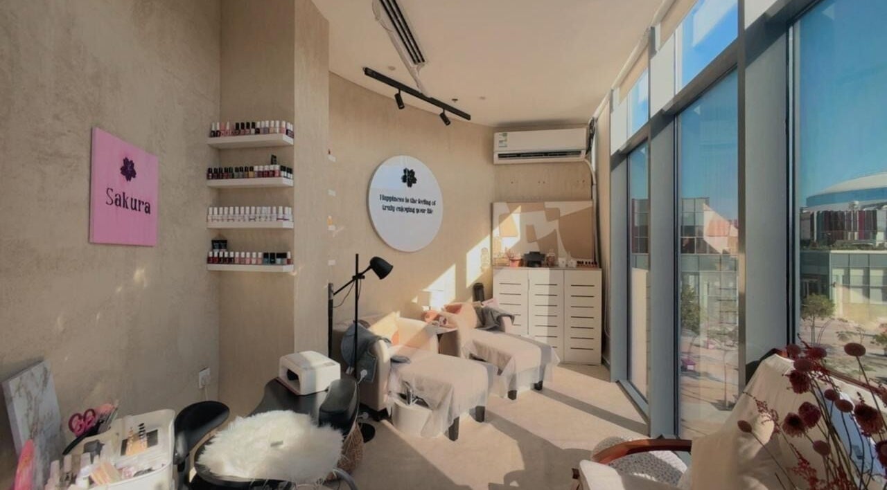 Bright and cozy interior of Sakura Spa in Al Khobar, Eastern Province, SA, featuring relaxing treatment chairs.