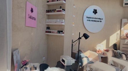 Cozy nail salon at Sakura Spa in Al Khobar, Eastern Province, SA with plush chairs and nail polish display.