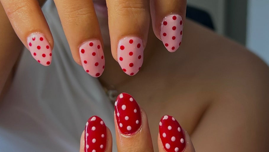 Polka dot nail art at Nails by Han, Cape Town, Western Cape, ZA, showcasing pink and red styles.