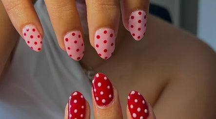 Polka dot nail art at Nails by Han, Cape Town, Western Cape, ZA, showcasing pink and red styles.
