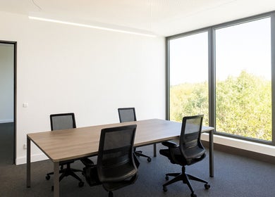 Bright meeting room at Retha Spa, Johannesburg, Gauteng, ZA with large windows and modern chairs.