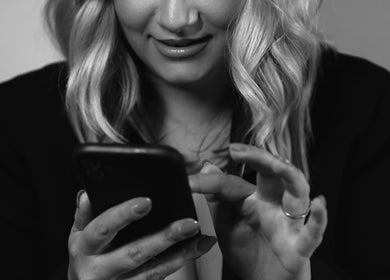 Client scheduling an appointment at Kylie’s Beauty Studio, Cape Town, Western Cape, ZA on mobile phone.