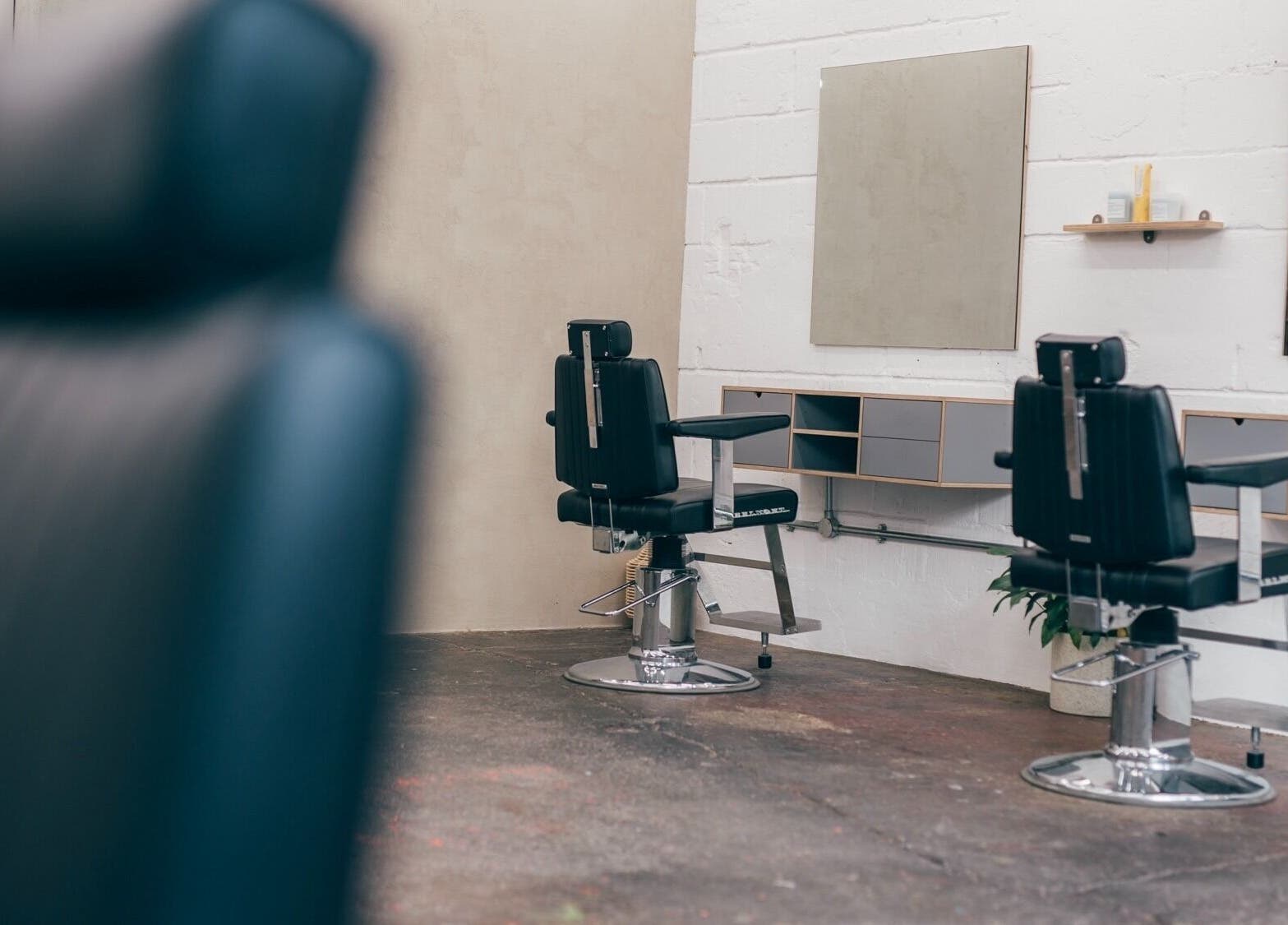 Chic salon chairs and mirrors at Nudo Studio, a beauty venue in London, England, GB.