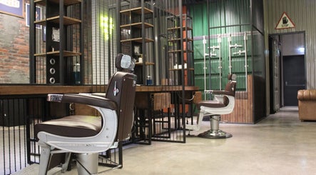 Elegant barber chair at Hair District Barbershop, Dubai, Dubai, AE, showcases modern style and comfort.