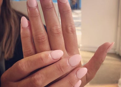 Elegant pink manicure at V-NAILS, Richmond, England, GB showcasing flawless nail artistry.