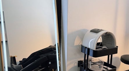 Therapeutic spa setup at AK CLINIC, Wolverhampton, England featuring a modern reclining chair.