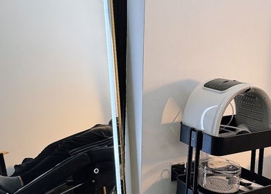 Treatment area at AK CLINIC, Wolverhampton, England, GB showing a comfortable chair and beauty equipment.