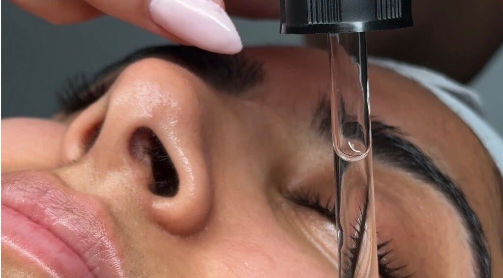 Close-up of facial serum application at Ak Clinic in Wolverhampton, England, GB.