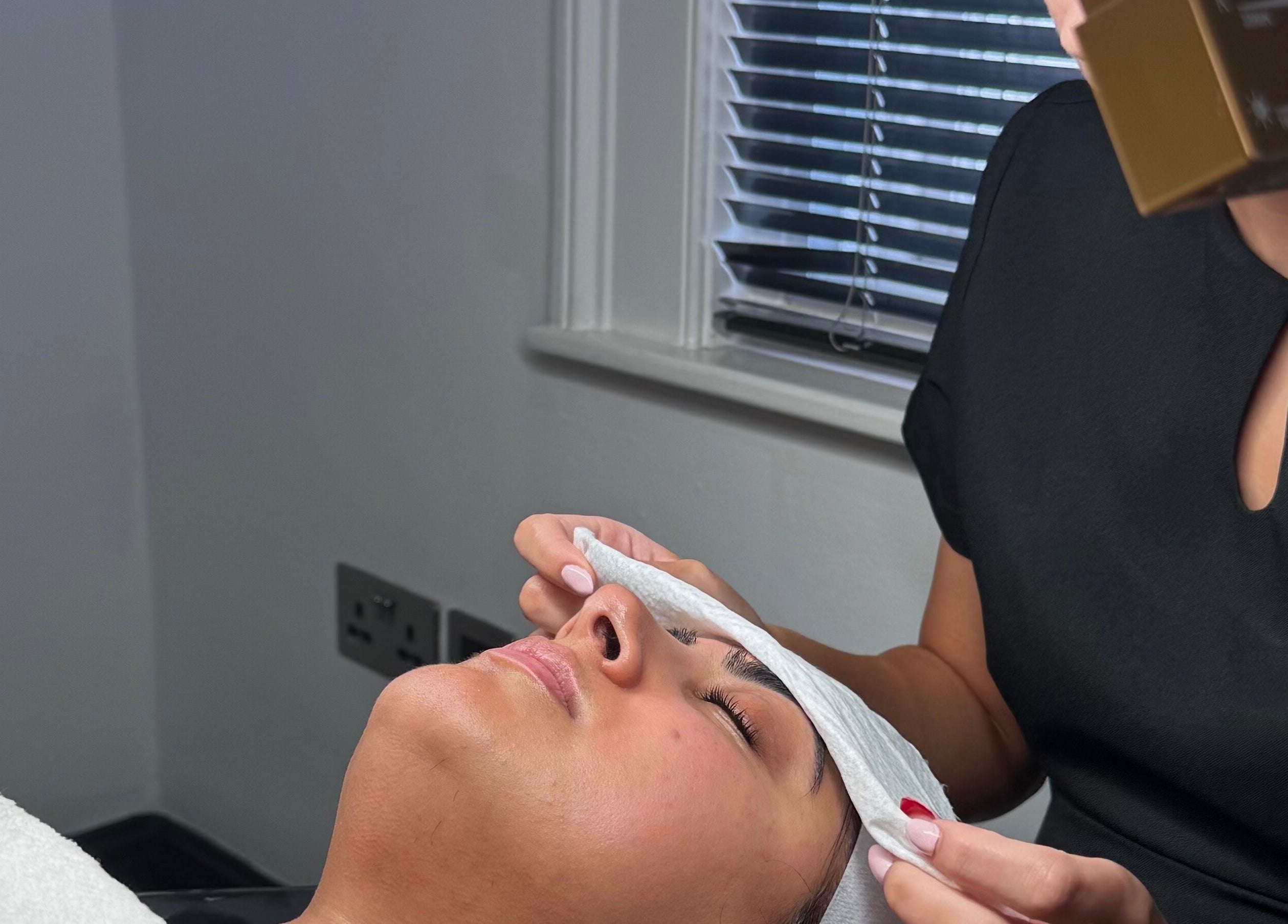 Relaxing facial treatment at Ak Clinic, Wolverhampton, England, GB offering rejuvenating skincare.