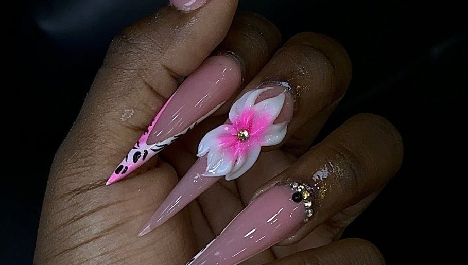 Elegant floral nails designed at Nailssxtam, Princes Town Regional Corporation, TT. Stylish art with gems and patterns.