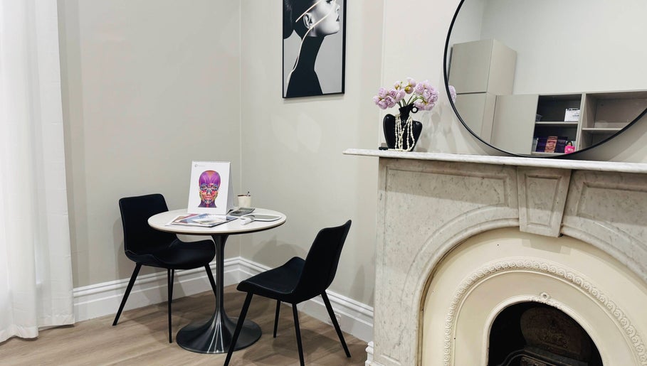 Elegant consultation space at Wink Aesthetics Clinic, Melbourne, Victoria, AU with modern decor and artwork.