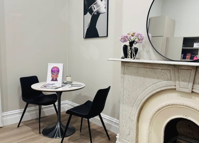 Elegant consultation space at Wink Aesthetics Clinic, Melbourne, Victoria, AU with modern decor and artwork.