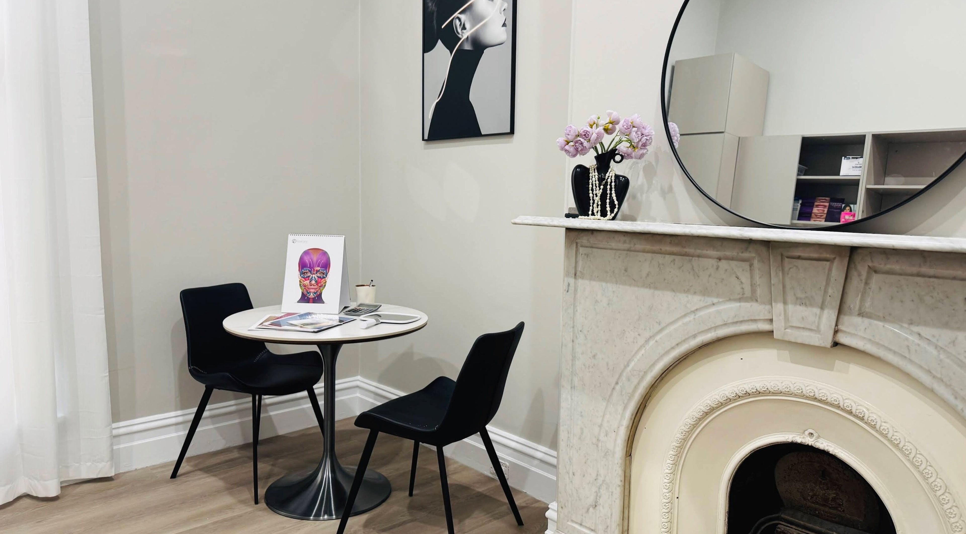 Elegant consultation space at Wink Aesthetics Clinic, Melbourne, Victoria, AU with modern decor and artwork.
