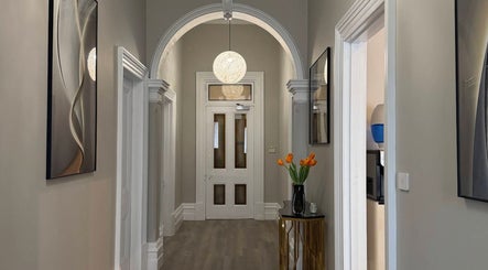 Elegant hallway at Wink Aesthetics Clinic, Melbourne, Victoria, AU with modern decor and soft lighting.
