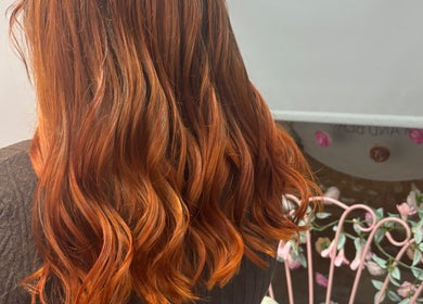 Flowing red hair beautifully styled at Luna Hair, Redditch, England, GB, showcasing vibrant color and expert care.