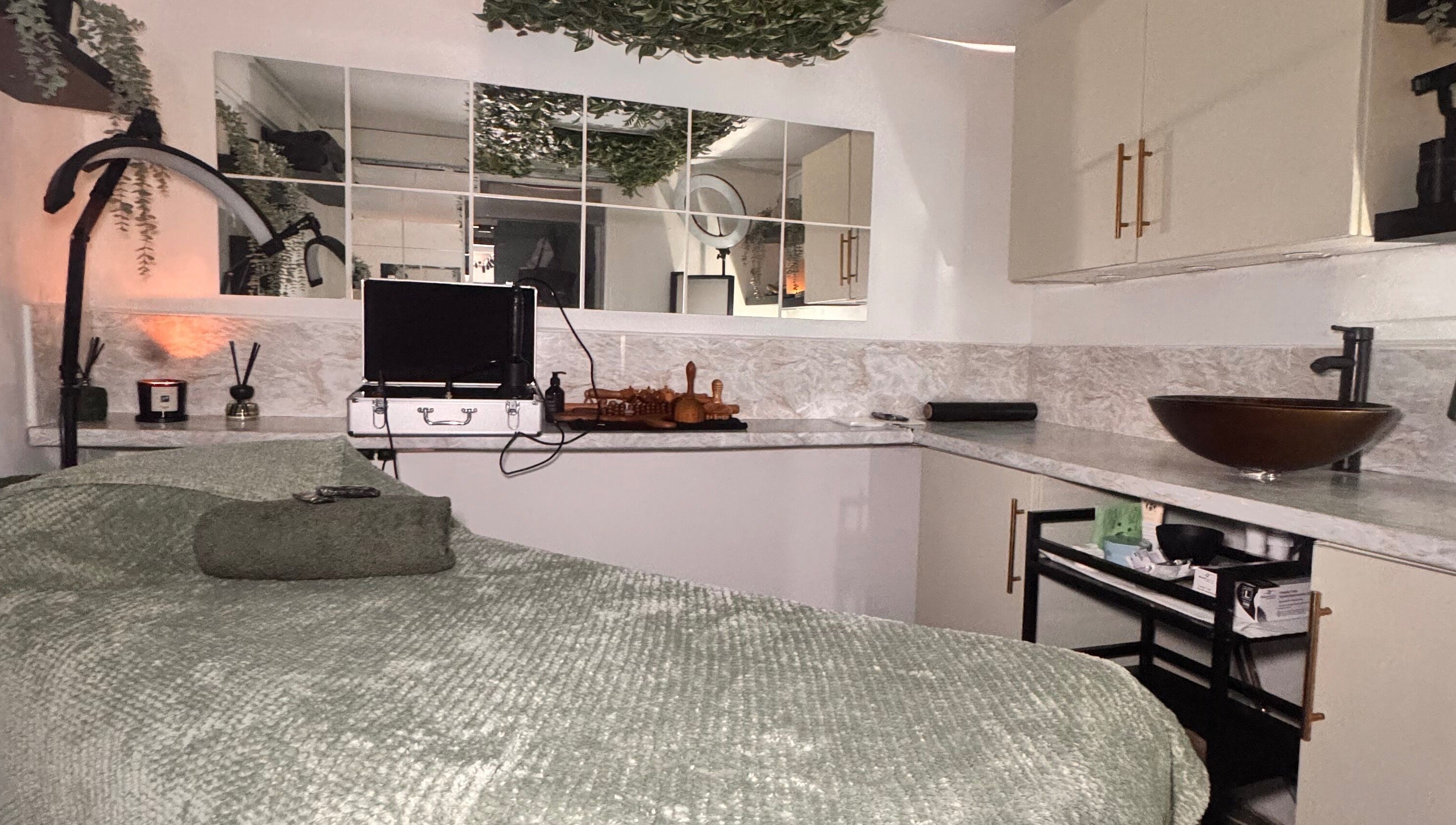 Relaxing treatment room at Khloe Sculpt Aesthetics, Caterham, England, GB with cozy decor and modern amenities.