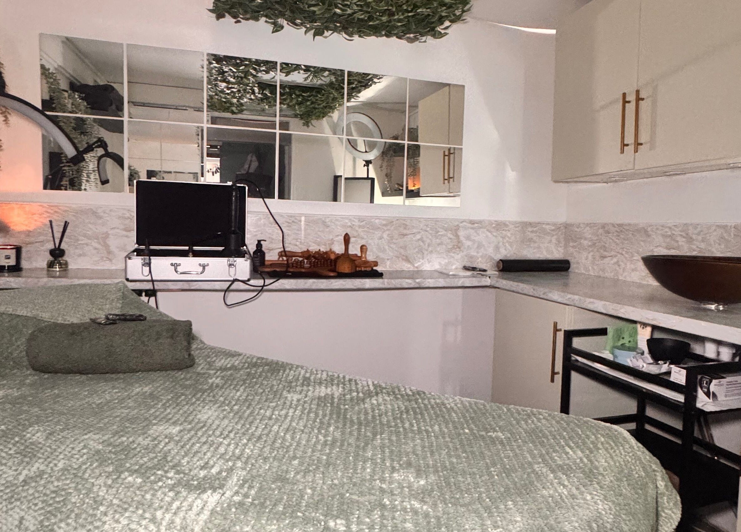 Relaxing treatment room at Khloe Sculpt Aesthetics, Caterham, England, GB with cozy decor and modern amenities.